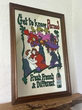 Load image into Gallery viewer, Beautiful French advertising piece of a well-known brand, a vivid, colourful design depicting a group of people in 60s fashionable clothing with a psychedelic feel picturing a couple, people dancing, and moulin rouge dancers on the exterior on the picture is the trendy fonts depicting the branding and further detail “ fresh, french and different” plus a picture of a bottle of Pernod on the edging in a waved colourful border in a wooden frame.
