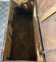 Load image into Gallery viewer, The antique oak coffer is of simple, plain form and has a hinged lid that opens to reveal a spacious interior. The coffer has a three-panel front and is raised on block feet. One of my favourite parts is the back panel that has been crudely chiselled from one section of oak, with an excellent, authentic craftsmanship finish.
