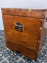 Load image into Gallery viewer, A beautiful Anglo-Indian Marriage Dowry chest circa 1900 with campaign handles and original wooden wheels, a very well-crafted and decorative chest, decorated with brass inlaid wire work, classically indicative of Indian artistry. This piece is a fine example of an Anglo-Indian chest. Designed as a dowry piece to be given by the father of the bride in an Indian wedding, you would have gold, jewellery, land deeds, money and fine linens stored inside.
