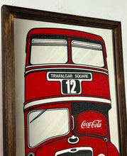 Load image into Gallery viewer, The mirror prominently features a red London double-decker bus with TRAFALGAR SQUARE and 12 on its destination sign, and Coca-Cola branding on the side of the bus. The license plate reads LON 80.
