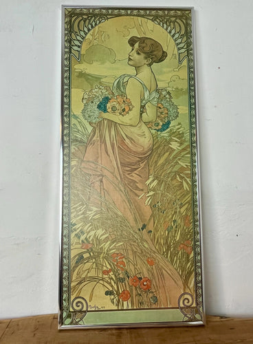 This piece portrays Summer as a sensual brunette, adorned with red poppies in her hair, leaning against a grapevine with her feet in shallow water.