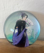 Load image into Gallery viewer, Vintage Art Deco style glass paperweight featuring an illustration of a woman, often referred to as a &quot;flapper lady&quot; or &quot;Gatsby lady&quot; due to the 1920s aesthetic.
