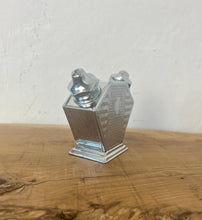 Load image into Gallery viewer, Stunning period piece, featuring a cute Art Deco combined salt and pepper shaker or cruet set, dating to the 1920s or 1930s due to its geometric design and use of chrome-plated metal.
