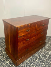 Load image into Gallery viewer, An immaculate quality Arts &amp; Crafts chest of drawers made in figured English mahogany. Having an arrangement of 2 over 2 drawers, all retaining the original decorative handles and escutcheons. With mahogany sides on a plinth. Beautiful original condition throughout. English, Circa 1900.
