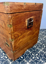 Load image into Gallery viewer, A beautiful Anglo-Indian Marriage Dowry chest circa 1900 with campaign handles and original wooden wheels, a very well-crafted and decorative chest, decorated with brass inlaid wire work, classically indicative of Indian artistry. This piece is a fine example of an Anglo-Indian chest. Designed as a dowry piece to be given by the father of the bride in an Indian wedding, you would have gold, jewellery, land deeds, money and fine linens stored inside.
