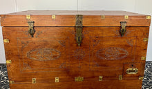 Load image into Gallery viewer, A beautiful Anglo-Indian Marriage Dowry chest circa 1900 with campaign handles and original wooden wheels, a very well-crafted and decorative chest, decorated with brass inlaid wire work, classically indicative of Indian artistry. This piece is a fine example of an Anglo-Indian chest. Designed as a dowry piece to be given by the father of the bride in an Indian wedding, you would have gold, jewellery, land deeds, money and fine linens stored inside.
