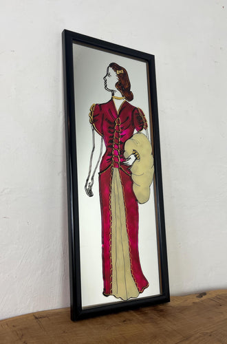 The mirror's design, characterised by the elegant lines of the woman's figure and attire, is indicative of the Art Deco era, which flourished in the 1920s and 1930s and is known for its glamorous and sophisticated aesthetic.