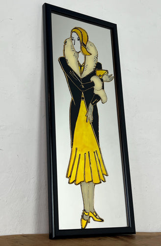 The mirror's design, characterised by the elegant lines of the woman's figure and attire, is indicative of the Art Deco era, which flourished in the 1920s and 1930s and is known for its glamorous and sophisticated aesthetic