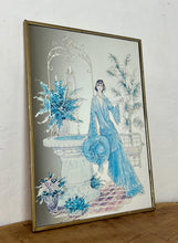 Load image into Gallery viewer, Beautiful Art Nouveau lady mirror featuring a glamorous lady with an elegant blue dress and hat with a Victorian Manor House background with a fountain, and wonderful matte effect tones.
