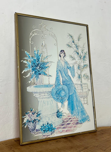 Beautiful Art Nouveau lady mirror featuring a glamorous lady with an elegant blue dress and hat with a Victorian Manor House background with a fountain, and wonderful matte effect tones.