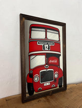 Load image into Gallery viewer, The mirror prominently features a red London double-decker bus with TRAFALGAR SQUARE and 12 on its destination sign, and Coca-Cola branding on the side of the bus. The license plate reads LON 80.
