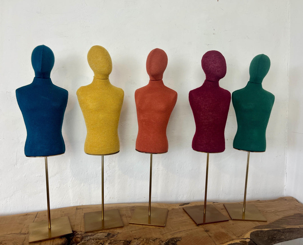 Vintage selection of a row of colourful fabric torso mannequins on stands, suitable for displaying jewellery, and can be used in your home, in a retail setting, or for fashion purposes.