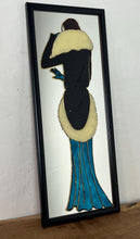 Load image into Gallery viewer, The artwork is further enhanced by the addition of raised, textured elements, outlines of the figure and details of the dress and fur collar. This creates a tactile, three-dimensional quality to the piece, contrasting with the smooth mirrored surface.
