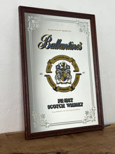 Load image into Gallery viewer, Vintage Ballantine&#39;s Finest Scotch Whisky advertising mirror, featuring the brand&#39;s name, crest, and the declaration &quot;FINEST SCOTCH WHISKY EST. 1827&quot;.

