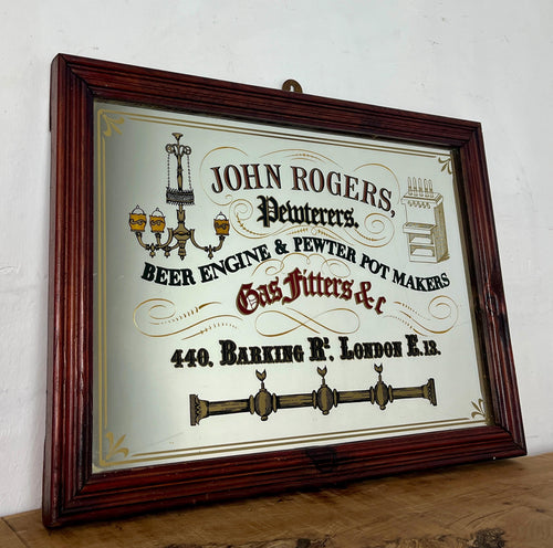 The stunning visuals showcase a beer engine, antique ceiling light, and candlelight with an intricate finish. The mirror has a dual gold border and floral design hinting at the corners. This piece will create a standout piece to add history and superb design to your home.