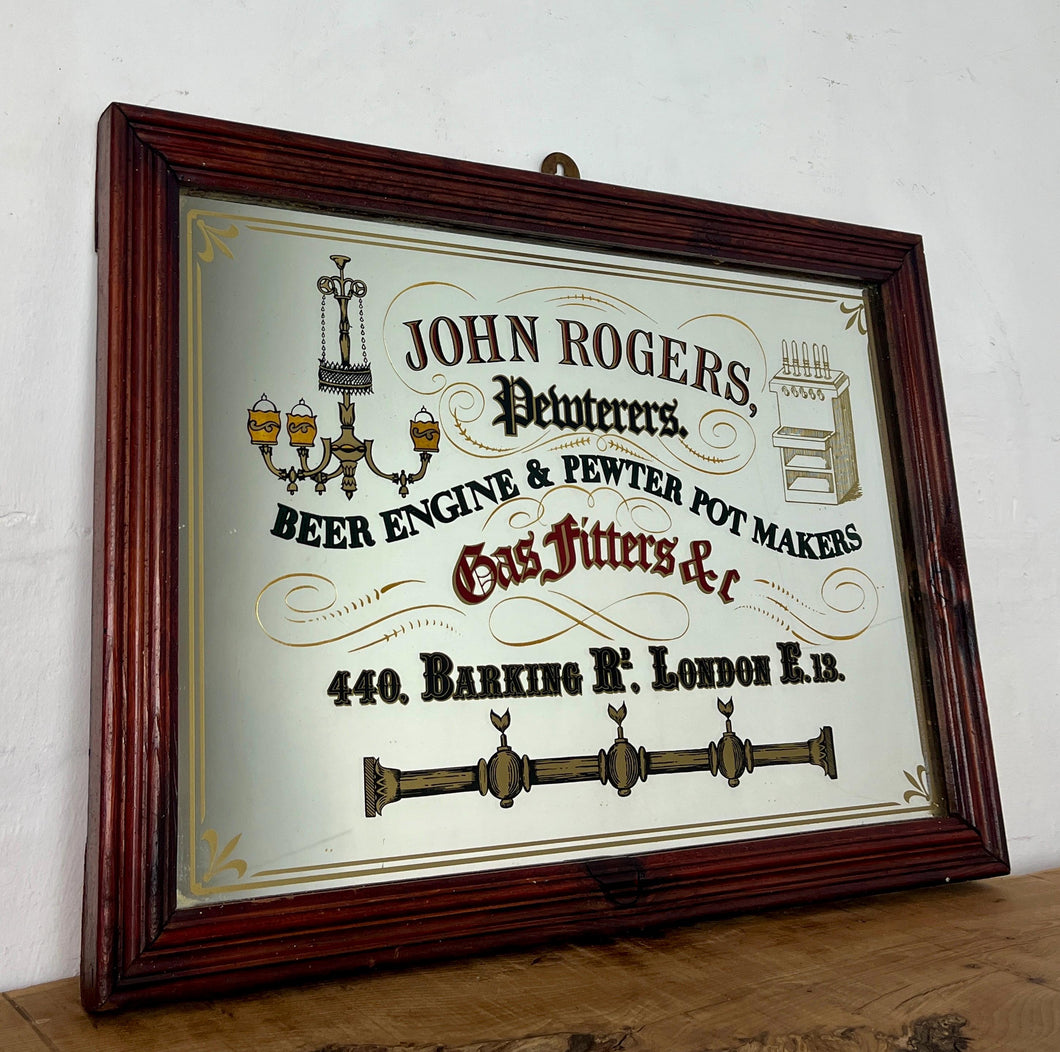 The stunning visuals showcase a beer engine, antique ceiling light, and candlelight with an intricate finish. The mirror has a dual gold border and floral design hinting at the corners. This piece will create a standout piece to add history and superb design to your home.