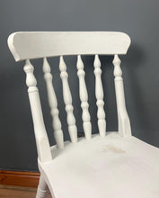 Load image into Gallery viewer, This sturdy spindle back chair is a classic style of wooden chair featuring a seat, a backrest, and a series of turned spindles that connect them.
