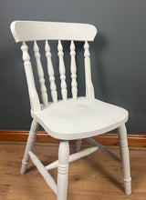 Load image into Gallery viewer, This sturdy spindle back chair is a classic style of wooden chair featuring a seat, a backrest, and a series of turned spindles that connect them.
