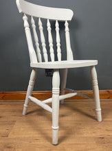 Load image into Gallery viewer, This sturdy spindle back chair is a classic style of wooden chair featuring a seat, a backrest, and a series of turned spindles that connect them.
