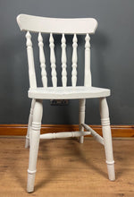 Load image into Gallery viewer, This sturdy spindle back chair is a classic style of wooden chair featuring a seat, a backrest, and a series of turned spindles that connect them.
