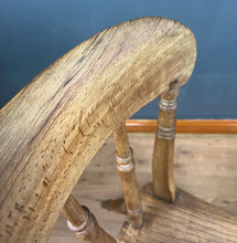 Load image into Gallery viewer, This style is a type of Windsor chair, a design that originated in England in the early 18th century and is characterised by its solid wooden seat into which the legs and spindles of the back are inserted.
