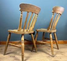 Load image into Gallery viewer, A classic design, featuring a lath back and a pleasingly shaped seat, combined with excellent build craftsmanship. The seat stands on turned legs with a single H-stretcher, making the chairs sturdy.
