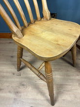 Load image into Gallery viewer, A classic design, featuring a lath back and a pleasingly shaped seat, combined with excellent build craftsmanship. The seat stands on turned legs with a single H-stretcher, making the chairs sturdy.
