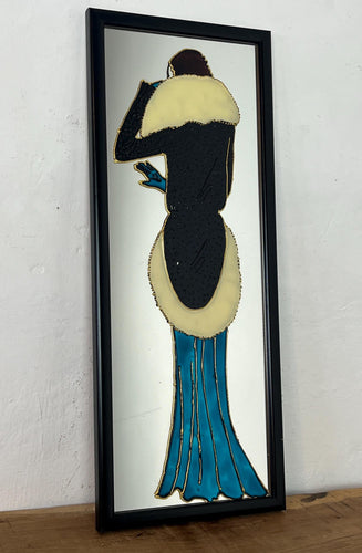 The artwork is further enhanced by the addition of raised, textured elements, outlines of the figure and details of the dress and fur collar. This creates a tactile, three-dimensional quality to the piece, contrasting with the smooth mirrored surface.