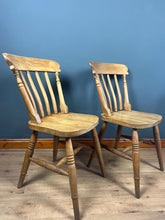 Load image into Gallery viewer, A classic design, featuring a lath back and a pleasingly shaped seat, combined with excellent build craftsmanship. The seat stands on turned legs with a single H-stretcher, making the chairs sturdy.
