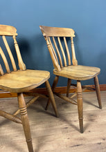 Load image into Gallery viewer, A classic design, featuring a lath back and a pleasingly shaped seat, combined with excellent build craftsmanship. The seat stands on turned legs with a single H-stretcher, making the chairs sturdy.
