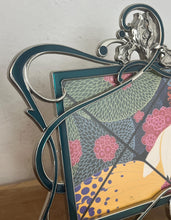 Load image into Gallery viewer, Beautiful vintage picture frame designed in the Art Deco style, featuring ornate, flowing lines and a green enamel finish. It is made from metal, likely pewter or a silver-plated alloy.
