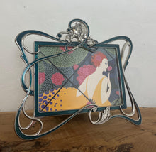 Load image into Gallery viewer, Beautiful vintage picture frame designed in the Art Deco style, featuring ornate, flowing lines and a green enamel finish. It is made from metal, likely pewter or a silver-plated alloy.
