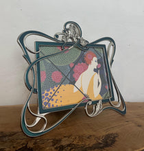 Load image into Gallery viewer, Beautiful vintage picture frame designed in the Art Deco style, featuring ornate, flowing lines and a green enamel finish. It is made from metal, likely pewter or a silver-plated alloy.

