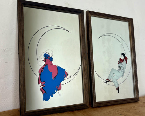 This pair of stunning Art Deco mirrors depicting a Pierrot or Harlequin on a crescent moon is an illustration, first and foremost, of a woman in an Art Deco style, vintage from the mid-20th century.