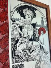 Load image into Gallery viewer, A central female figure with flowing hair, a common motif in Mucha's works. Rich, decorative elements including flowers and an ornate background, emphasizing nature's forms.
