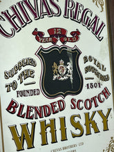 Load image into Gallery viewer, The mirror features vibrant, bold fonts in fabulous colours, with the royal crest in the middle and an intricate golden border. It is presented in a wooden frame and is in vintage condition, with a few signs of authentic patina.
