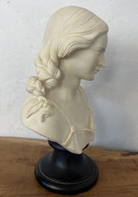 Load image into Gallery viewer, The figure depicts a young woman with wavy hair gathered into ringlets over her shoulders, wearing a draped garment with spaghetti straps and rosette detailing. Her facial expression is serene with downcast eyes.
