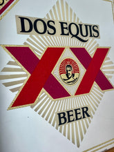 Load image into Gallery viewer, The design features the brand name, the "XX" symbol, the word "BEER", and the face of an Aztec ruler in the centre.
