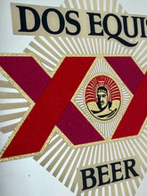 Load image into Gallery viewer, The design features the brand name, the "XX" symbol, the word "BEER", and the face of an Aztec ruler in the centre.
