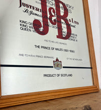 Load image into Gallery viewer, The most prominent feature is the large, bold, red "J&amp;B" logo in a distinctive typeface.
