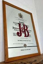 Load image into Gallery viewer, The most prominent feature is the large, bold, red "J&amp;B" logo in a distinctive typeface.
