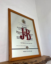 Load image into Gallery viewer, The most prominent feature is the large, bold, red "J&amp;B" logo in a distinctive typeface.
