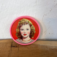 Load image into Gallery viewer, Beautiful mid-century vintage compact mirrors or small circular handbag mirrors featuring pin-up style art from the mid-20th century.
