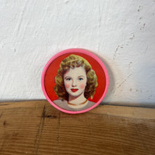 Load image into Gallery viewer, Beautiful mid-century vintage compact mirrors or small circular handbag mirrors featuring pin-up style art from the mid-20th century.
