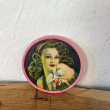 Load image into Gallery viewer, Beautiful mid-century vintage compact mirrors or small circular handbag mirrors featuring pin-up style art from the mid-20th century.
