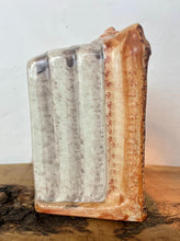 Load image into Gallery viewer, This style of hand-painted, glazed ceramic item, sometimes featuring floral designs or specific scenes, has a whimsical, hand-painted design with a military theme, incorporating several small seated toy figures and a cannon figurine.
