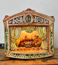 Load image into Gallery viewer, This style of hand-painted, glazed ceramic item, sometimes featuring floral designs or specific scenes, has a whimsical, hand-painted design with a military theme, incorporating several small seated toy figures and a cannon figurine.
