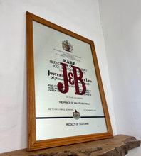 Load image into Gallery viewer, The most prominent feature is the large, bold, red "J&amp;B" logo in a distinctive typeface.
