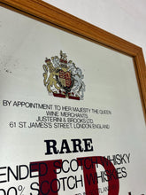 Load image into Gallery viewer, The most prominent feature is the large, bold, red "J&amp;B" logo in a distinctive typeface.
