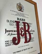 Load image into Gallery viewer, The most prominent feature is the large, bold, red "J&amp;B" logo in a distinctive typeface.
